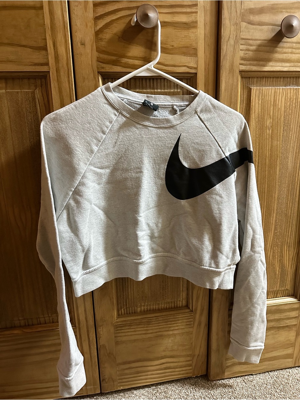 Nike Women's Light Gray Cropped Sweatshirt with Black Swoosh Accent